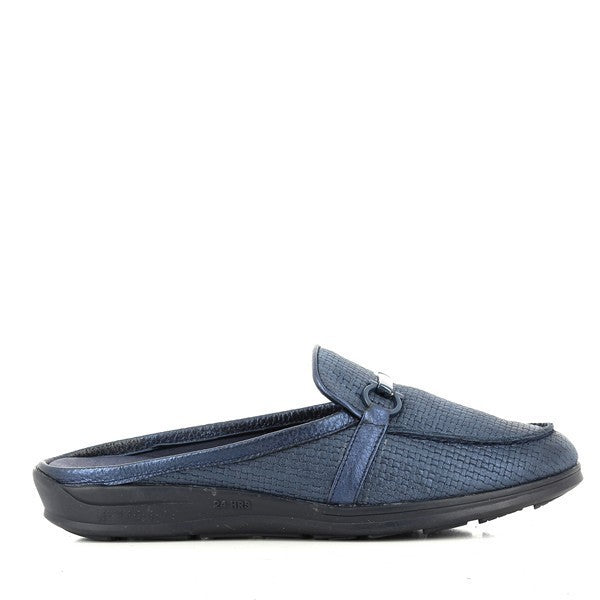 A pair of 24 Hrs 23510 Lake Navy Slide-On Loafers displayed against a neutral background. The loafers feature a rich navy leather upper with a sleek, rounded toe and a low 2.5 cm heel. The smooth leather lining and flexible synthetic sole highlight the craftsmanship and comfort of this Spanish-made women's shoe.