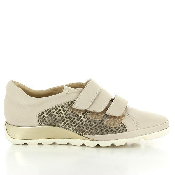 A pair of Amalfi Mimmo Beige Sneakers is displayed against a simple, clean background. The sneakers feature a soft beige leather upper with three velcro straps for easy fastening. A subtle snake print detail on the side adds a touch of sophistication. The shoes rest on a 2.5cm heel-platform, highlighting the combination of style and comfort. The synthetic sole is visible, showcasing its durability and grip. The overall design captures the luxurious craftsmanship and elegant simplicity of these women's sneak