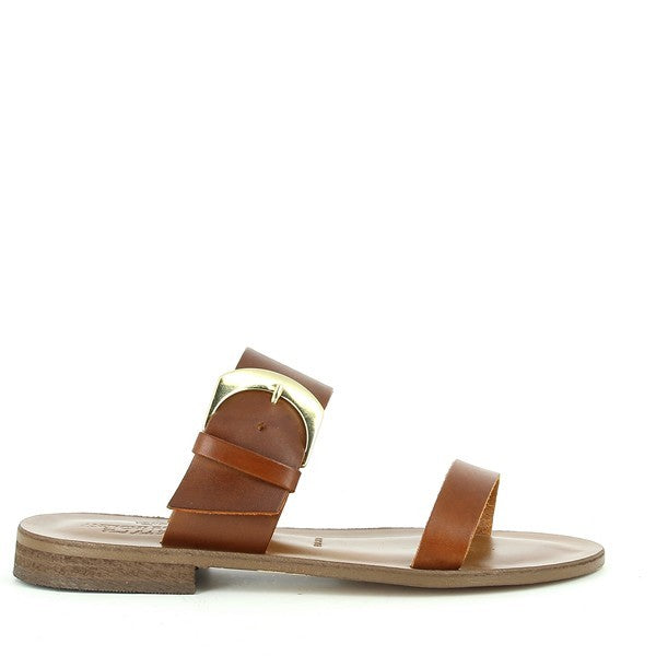 The image showcases a pair of Antichi Romani 926 Cuoio Tan Two-Strap Slides, beautifully displayed against a soft, neutral background. The rich tan leather straps have a smooth finish, highlighting the craftsmanship and quality of the materials. The simple yet elegant two-strap design offers a timeless look, while the round toe shape adds a subtle softness to the silhouette.