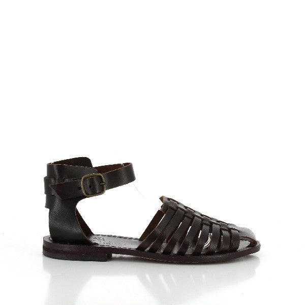 A pair of Antichi Romani 165 Black Cage Slingback Sandals is elegantly presented against a neutral background. The sandals feature a striking cage design with intricate black leather straps that encase the foot, leading to a slim slingback strap around the heel. The 2 cm heel adds a subtle lift, while the round toe design ensures a classic look. The leather is smooth and luxurious, highlighting the expert craftsmanship.