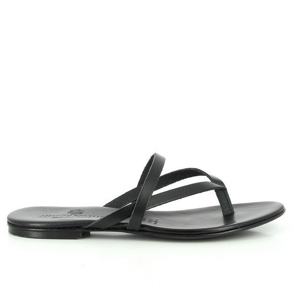 The Antichi Romani 541 Black Thong Slides are elegantly displayed against a soft, neutral background, emphasizing their sleek and minimalist design. The upper features smooth black leather with a subtle sheen, showcasing the quality craftsmanship of the Italian brand. The thong style is complemented by a comfortable, rounded toe, while the 1cm platform heel adds a slight lift without compromising comfort. The soft leather lining is visible, hinting at the luxurious feel inside.