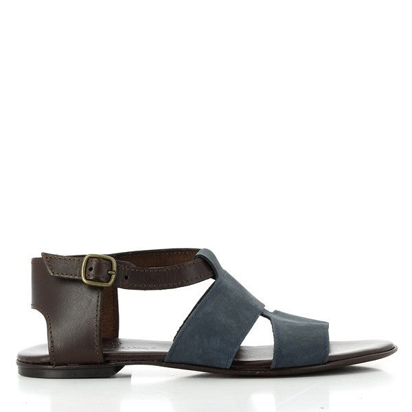 The navy leather upper blends seamlessly with brown accents, highlighting the sleek, handcrafted design. The adjustable slingback strap with a silver buckle ensures a perfect fit, while the 1cm platform adds a subtle lift.