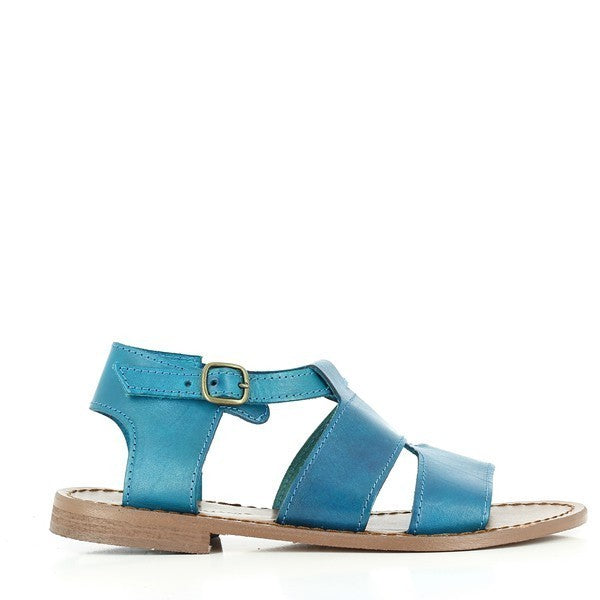 The vibrant turquoise leather upper stands out, showcasing the sleek design and rounded toe shape. The adjustable slingback strap is elegantly fastened with a silver buckle, ensuring a secure fit while adding a touch of sophistication.