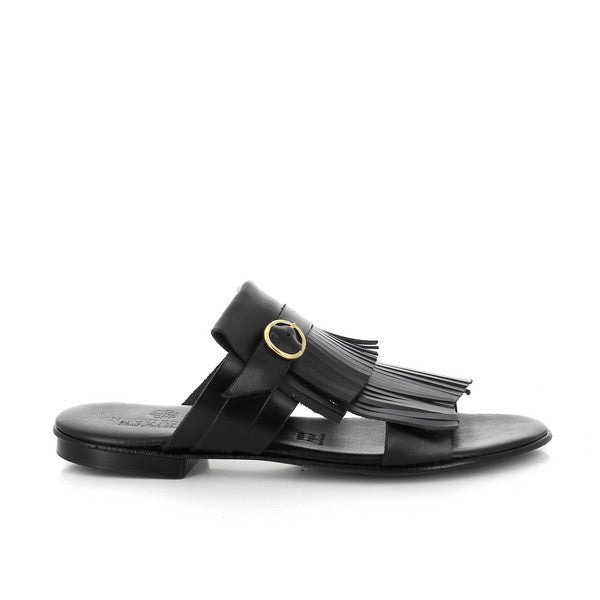 The image features a pair of Antichi Romani 906 Nero Black Fringe Slides elegantly presented on a textured, neutral background. The slides showcase a chic black leather upper adorned with stylish fringe detailing, highlighting the exquisite craftsmanship of the Italian brand. The round toe shape adds a soft, feminine touch, while the 2cm heel-platform height provides a subtle lift for comfort and elegance.