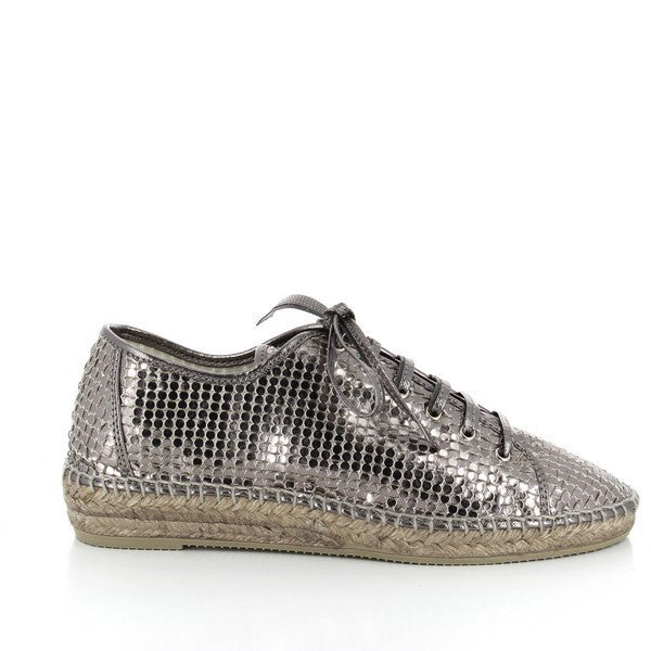 The Calzanor 1851 Silver Espadrilles feature a sleek and stylish design, showcasing a shimmering silver leather upper that catches the light beautifully. The round toe adds a touch of classic charm, while the soft leather lining ensures comfort. Set on a lightweight synthetic sole, the espadrilles have a modest 3 cm heel-platform height. The eco-friendly yute sole provides a sustainable touch, making these espadrilles perfect for both casual and dressy occasions.