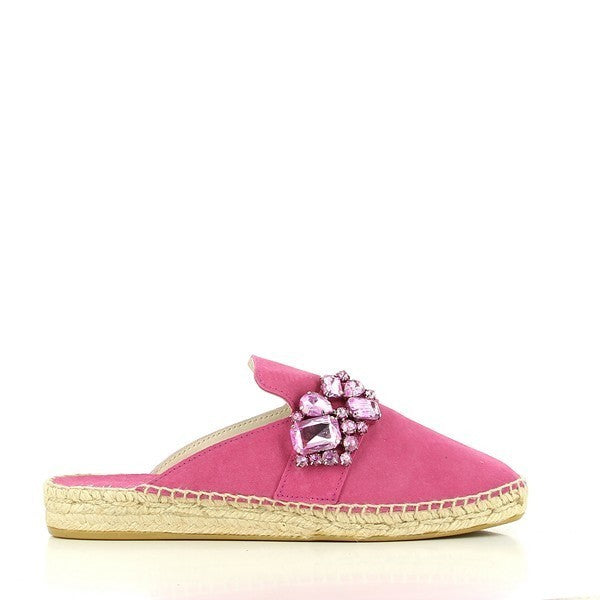 A pair of Calzanor 2141 Pink Slide Espadrilles is showcased against a soft, neutral background. The striking pink leather upper glistens in the light, complemented by the elegant front jewel detail that adds a touch of glamour. The round toe shape maintains a classic appeal, while the natural jute sole, slightly visible, highlights its eco-friendly and breathable qualities. The 4.5cm heel-platform provides a subtle lift, making these espadrilles both stylish and comfortable.