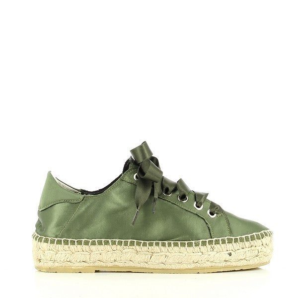 A pair of Calzanor 2149 Khaki Lace-Up Espadrilles is displayed against a light, neutral background. The rich khaki leather upper features a smooth finish, accentuated by a stylish lace-up design that adds a touch of sophistication. The round toe shape complements the overall elegant silhouette, while the eco-friendly jute sole is slightly visible, highlighting its breathable and flexible qualities. The 4cm heel-platform provides a subtle lift, making these espadrilles both fashionable and comfortable.