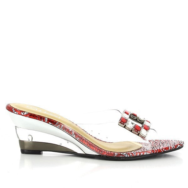 A side view of the Dalessi Damsel Red Slides, showing off the vibrant red synthetic upper, the 6 cm heel, and the silver buckle for a chic, modern look.