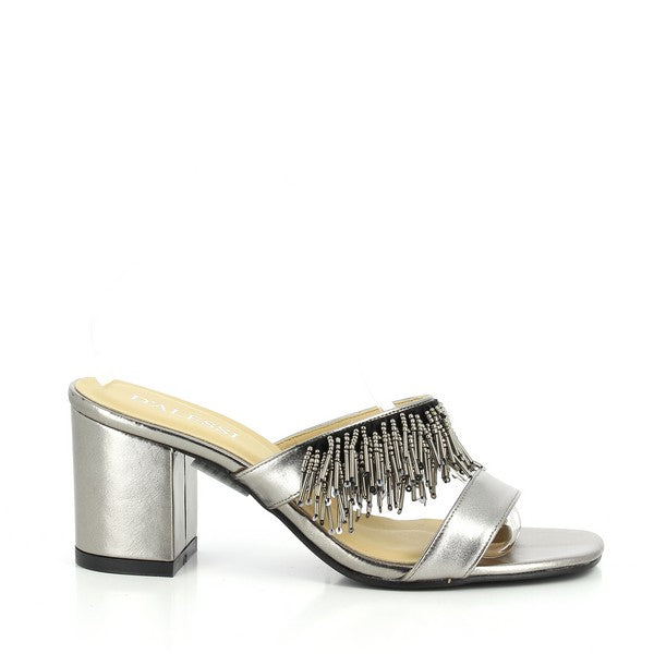 The Dalessi Deity Pewter Slides feature a stylish front strap with a decorative jewel fringe and a 7 cm square heel, offering a chic, elegant design perfect for any occasion.