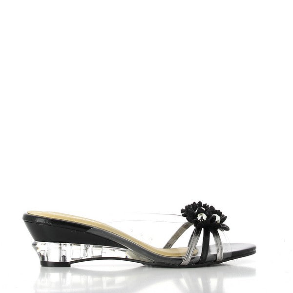 A clean side view of the Dalessi Dupont Black & Pewter Slides, showcasing the sleek leather upper and the elegant transparent floral decoration. The smooth lines of the shoe emphasize its modern design, while the rounded toe provides a classic touch.