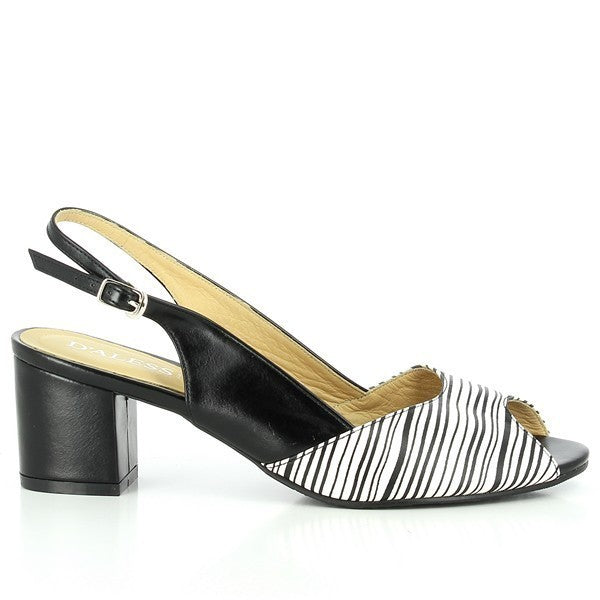 A profile view of the Dalessi Duprey Strips Black & White Slingback Sandals, showcasing the sleek white leather upper with bold black stripes. The round toe shape and classic slingback design offer a timeless, elegant silhouette.