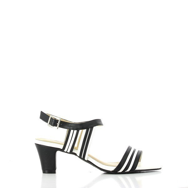 A profile view of the Dalessi Paprika Black Slingback Sandals, showcasing the sleek black leather upper with a bold strap featuring black and white stripes. The 6.5 cm heel-platform is visible, adding a sophisticated lift to the design.