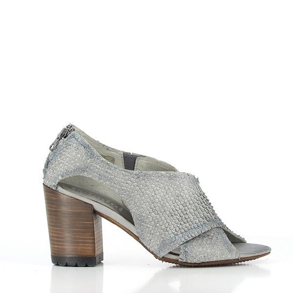 The side of the Felmini 9377 Grey Snake Print Booties showcases the sleek and elegant design. The high-quality leather upper is adorned with a striking grey snake print pattern, adding a touch of sophistication and texture. The 8cm heel-platform height offers a comfortable yet stylish lift, while the peep-toe design gives a modern twist to this classic silhouette.