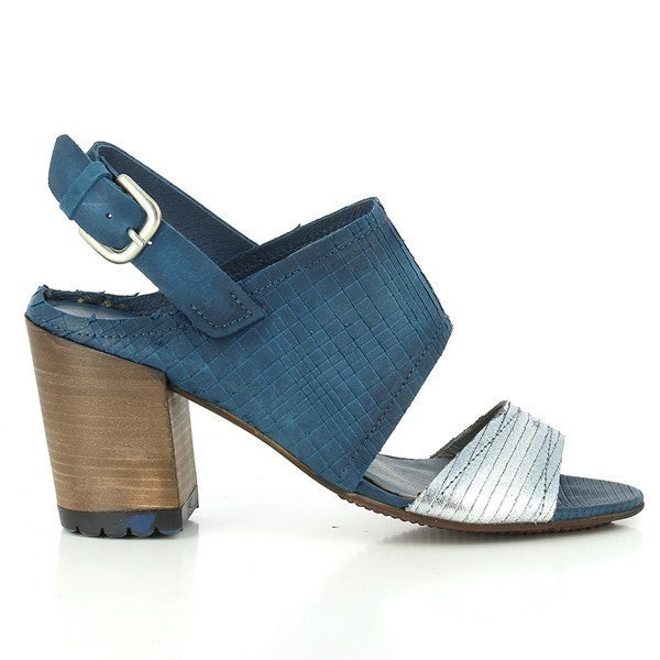 The side profile of the Felmini 9381 Blue & Silver Sandals highlights the elegant 8cm heel-platform height and the sleek silhouette. The two wide straps in vibrant blue and shimmering silver leather are the focal point, complemented by the adjustable ankle strap for a sophisticated yet secure fit.