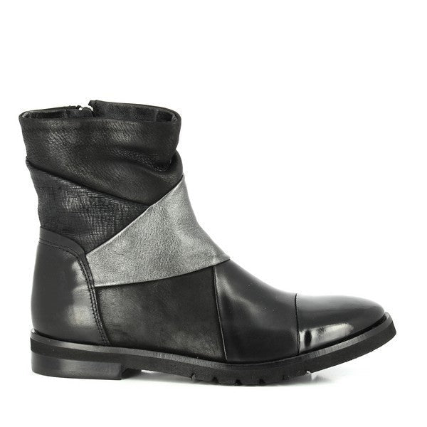 A clear view of the Felmini 9834 Black Ankle Boots from the side, showcasing the sleek leather upper and the silver accents that add a modern touch to the design. The 3cm heel provides subtle elevation, while the round toe shape enhances the classic style.