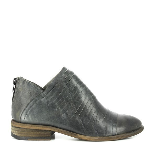 A clean profile view of the boot showcasing the soft grey leather upper, a subtle 3cm heel, and the streamlined round-toe shape. The texture of the leather highlights the handcrafted quality.