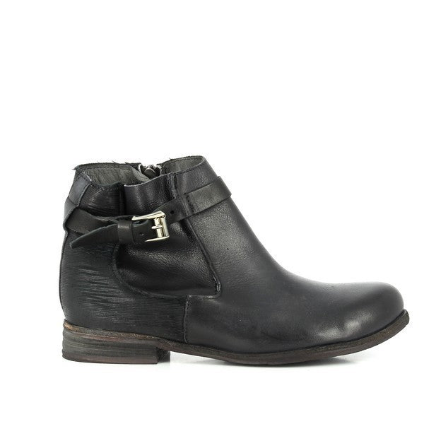 A sleek, full-profile shot showcasing the smooth black leather upper, the decorative strap with a buckle around the ankle, and the round-toe design.