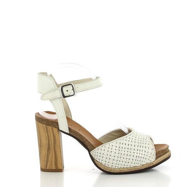 The side view of the Felmini B702 nude slingback sandals showcases the elegant, clean lines of the leather upper, with a sleek, round toe and a high 8.5cm heel that provides both style and comfort.
