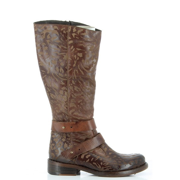 A side profile of the Felmini B931 Brown Long Boots, showcasing the smooth leather upper, decorative floral motifs, and sleek ankle strap that wraps around the boot for added detail.