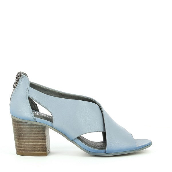 A close-up of the Felmini C307 light blue booties showcasing the smooth leather upper with a sleek, modern design. The cross strap adds a unique touch while highlighting the rounded toe and slim heel.