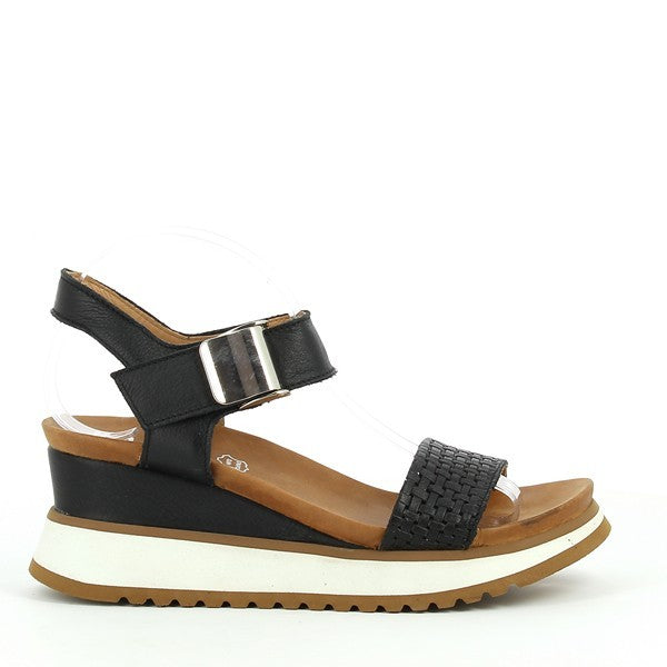 The sleek black leather of the Felmini C311 Slingback Sandals, showcasing a smooth, polished finish and a rounded toe design. The heel stands at a comfortable 6.5cm.