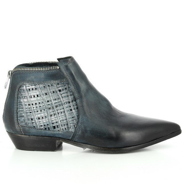 A close-up shot showcasing the sleek navy leather exterior of the Forte S17-4204 ankle boot. The smooth leather shines under the light, highlighting its high-quality craftsmanship.