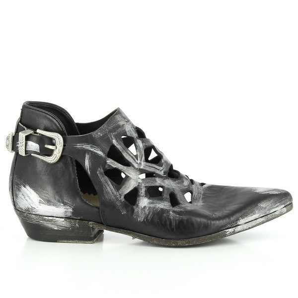 A sleek side profile of the black leather ankle boots showcasing the clean lines, pointed toe, and leather sole, highlighting the refined design.