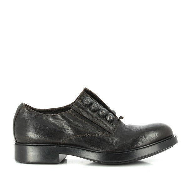 A dark brown leather slip-on shoe with a smooth, polished finish. The 3cm platform heel is visible, adding subtle elevation to the classic silhouette.