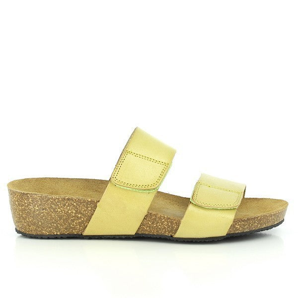 A detailed side view of Plakton's 243001 Green Low Heel Wedges, highlighting the sleek green leather upper, adjustable buckle, and the modest heel platform ranging from 1.5cm to 4cm. This angle showcases the elegant design and comfortable height.