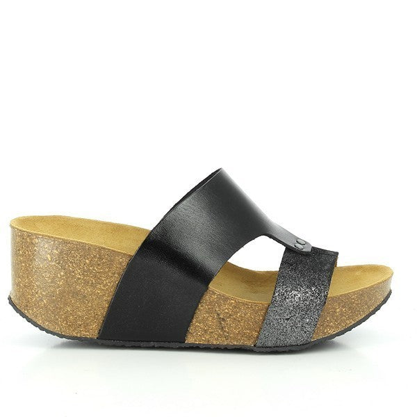 Step into shimmering elegance with Plakton's 275171 Black & Glitter Wedges. Crafted from luxurious leather and adorned with subtle glitter accents, these women's wedges from Spain blend style with comfort. Perfect for adding a touch of sophistication to any ensemble.