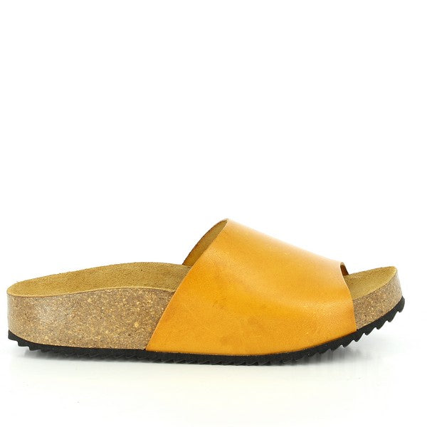 A side view of Plakton's 343036 Mustard Slides showcases its sleek profile and premium leather craftsmanship. The adjustable ankle strap and round toe shape highlight its versatile design, perfect for both casual outings and dressier occasions.