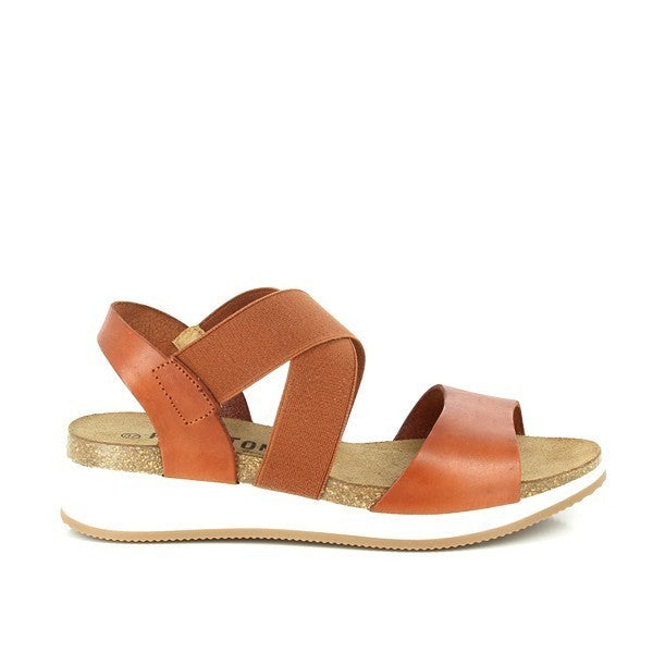 Capture the side profile showcasing the elegant cross-strap design and the 4cm cork wedge heel. This angle highlights the sandals' stylish silhouette and comfort features.