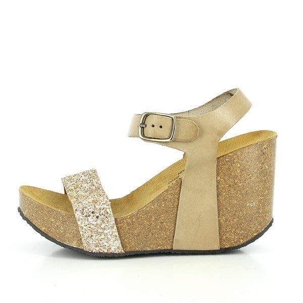 A captivating photo showcasing Plakton's 433023 Nude Slingback Wedges. Crafted from premium leather with a cork sole, these sandals feature an adjustable ankle strap for a personalized fit. Perfect for eco-conscious fashionistas seeking elegance and comfort.