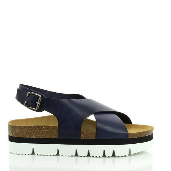 A stylish photo showcasing Plakton's 465166 Navy Cross-Strap Platforms. These women's sandals feature elegant navy leather cross-straps, a 5 cm platform heel, and a synthetic sole with a cork base. The design includes a round toe shape and an adjustable slingback strap with a buckle for a secure fit. Perfect for modern, eco-conscious fashionistas.