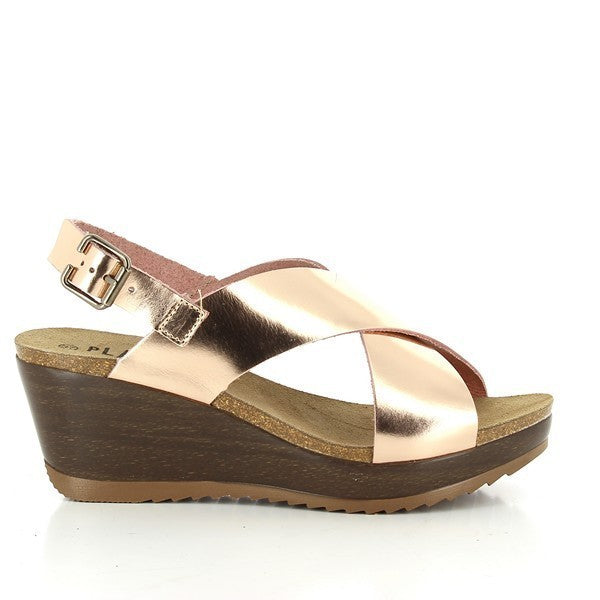 A captivating image featuring Plakton's 525285 Pink Cross-Strap Slingback Wedges. These stylish sandals boast a chic pink hue with cross-strap detailing, set against a backdrop that highlights their elegant design and comfortable wedge heel. Ideal for adding sophistication to any outfit, from casual daywear to evening outings.