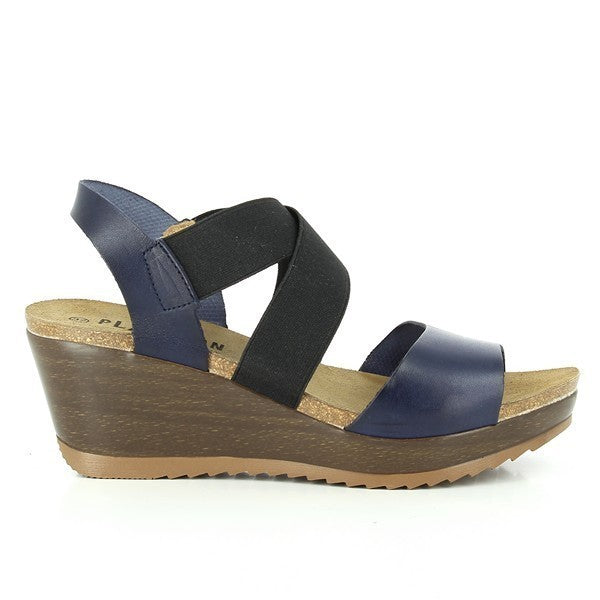 Step into timeless elegance with Plakton's 525286 Navy Cross-Strap Wedges. Crafted in Spain from premium leather and featuring a 5 cm cork sole, these sandals blend chic design with all-day comfort. Ideal for every occasion, from casual outings to sophisticated events.