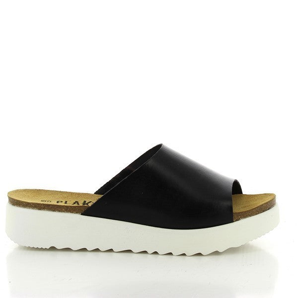 Capture the sleek elegance of Plakton's 665168 Black Wedges in this photo. Handcrafted in Spain from premium leather, these women's sandals feature a wide strap, cork insole, and a white synthetic sole. Perfect for adding stylish comfort to any outfit, whether for work or leisure.