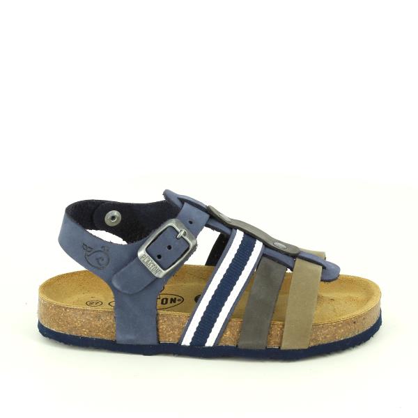 The photo captures the side of Plakton's 125639 Navy Multi-Strap Kids Sandals, showcasing the high-quality leather upper and the ridged natural cork sole with a 2cm heel-platform. The multi-strap design and buckle ankle strap are prominently displayed.