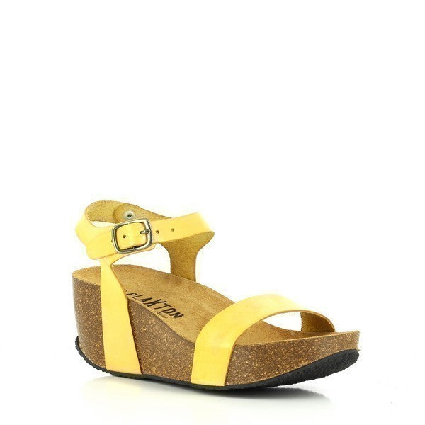 Showcase the wedge heel and round toe shape of Plakton's 273023 Yellow Wedges, emphasizing their stylish design and comfort features.