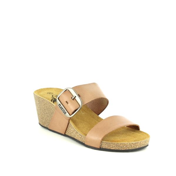 A dynamic angle reveals the stylish design of Plakton's sandals, featuring the natural leather lining and cork sole with a synthetic base. This perspective highlights the craftsmanship from Spain, showcasing the attention to detail in every stitch and curve of the sandal.