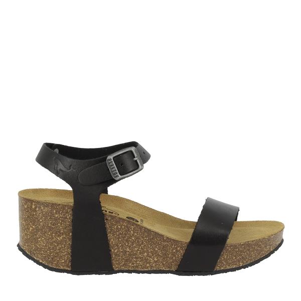 A side view of the Plakton 873023 Black Slingback Wedges showcases the sleek, elegant design with its black leather upper and a 7cm cork wedge heel. The simple, clean lines highlight the versatile style perfect for various occasions.