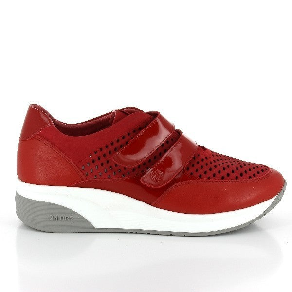 Showcasing the 24 Hrs 22832 Red Sneakers, these women's shoes feature a striking red leather upper complemented by two adjustable velcro straps. The sleek round toe and flat sole offer a modern, comfortable fit, while the high-quality leather lining ensures breathability and softness. Made in Spain, these sneakers combine vibrant style with durable craftsmanship.
