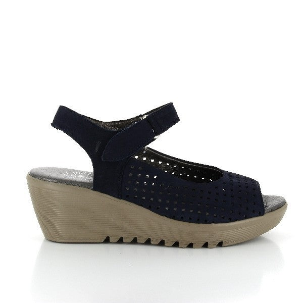 The 24 Hrs 22899 Black Slingback Wedges are shown from the side, highlighting their sleek black leather upper. The open front design and round toe are prominently displayed, showcasing the sandal's elegant and modern style. The 6 cm heel-platform height adds a sophisticated lift.