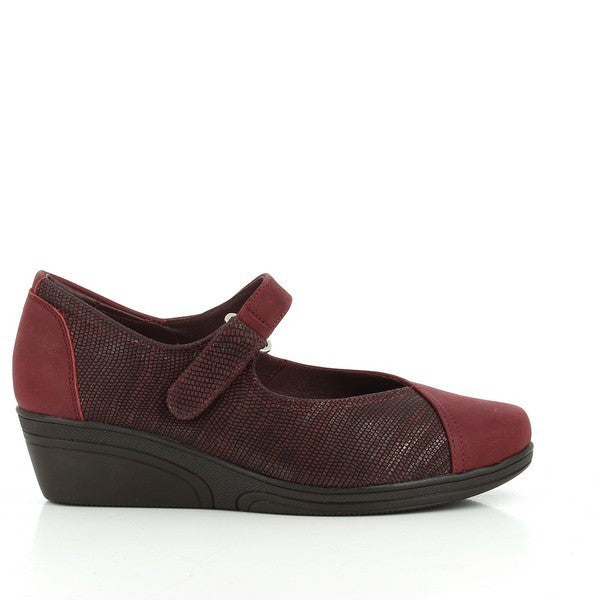 The 24 Hrs 23005 Burgundy Low Heels are displayed from the side, highlighting the rich burgundy leather upper and the elegant 3 cm heel. The round toe and smooth finish emphasize the shoe's classic and sophisticated design.