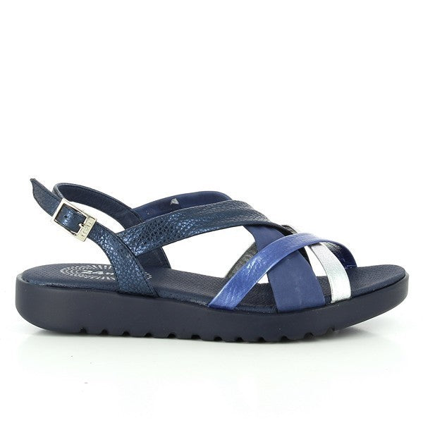 A pair of 24 Hrs 23252 Navy Cross-Strapped Slingback Sandals for women is elegantly displayed on a neutral background. The sandals feature a navy leather upper with a multi-strap cross-strapped design and a sleek buckle for a secure fit. The 2 cm heel and soft leather lining ensure both comfort and style, highlighting the sophisticated craftsmanship and design made in Spain.