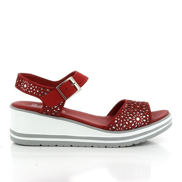 The 24 Hrs 23320 Red Slingback Sandals are showcased against a neutral background. The sandals feature a striking red leather upper with a sleek slingback design and an adjustable ankle buckle for a secure fit. The 5 cm heel-platform adds a chic lift, while the classic round toe shape ensures timeless elegance. The soft leather lining and durable synthetic sole highlight the superior craftsmanship of these Spanish-made sandals, perfect for adding a vibrant touch to any ensemble.