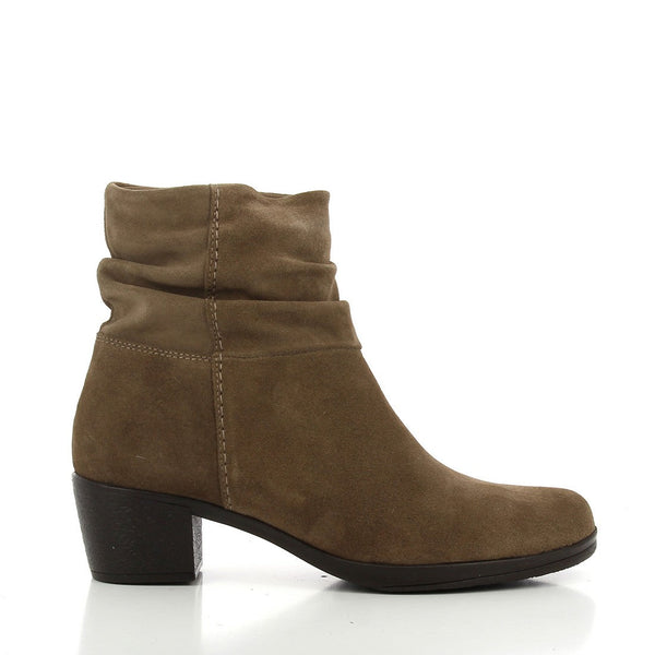 A pair of 24HRS 24192 Tan Ankle Boots shown from a slightly angled perspective, capturing the warm tan leather, the rounded toe, and the sturdy heel. The angle emphasizes the boots' stylish silhouette and the quality of the leather material.
