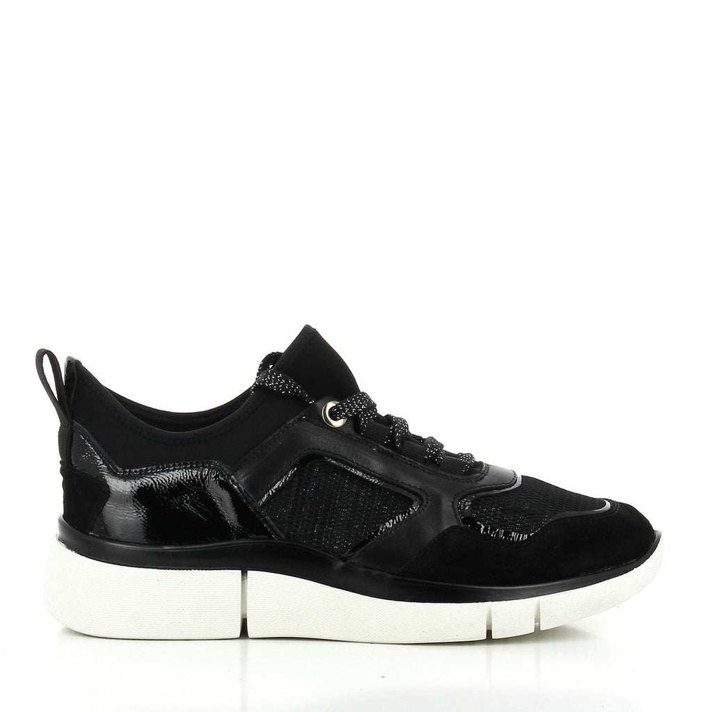 A pair of 24HRS 24308 Black Sneakers, showcasing their sleek black leather and material upper. The side view highlights the minimalist design and 3cm platform sole, providing a modern look with a subtle lift. The round toe shape offers a comfortable fit, while the material lining inside ensures all-day comfort. The back view shows the smooth heel area and the sturdy connection to the synthetic sole, emphasizing the high-quality craftsmanship.