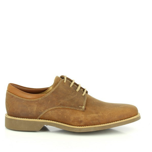 The Anatomic Delta Brown Oxford Shoes are showcased from the side, highlighting their sleek design and premium craftsmanship. The rich brown leather, smooth and supple, shines under soft lighting, emphasizing the meticulous stitching and elegant round toe. The cushioned footbed is visible through the open lace area, offering a glimpse of the comfort and support embedded in each step.
