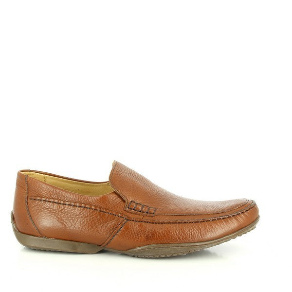 A sleek view of the Anatomic Paulista Tan Driver Shoe, showcasing the smooth leather upper with detailed stitching along the edges. The classic driver shoe silhouette with a slightly raised heel and flexible sole is clearly visible.
